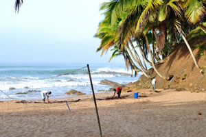 Beach cleaners are working in the sunny morning