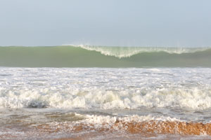 High wave is on the Axim beach