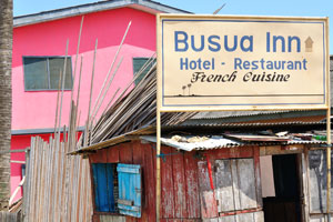 A pointer reads “Busua Inn, Hotel - Restaurant, French Cuisine”