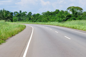 The smooth asphalt road is on the way from Kumasi to Cape Coast