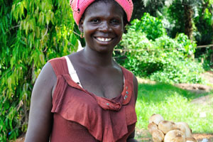 A lovely roadside female vendor suggests buying the mushrooms