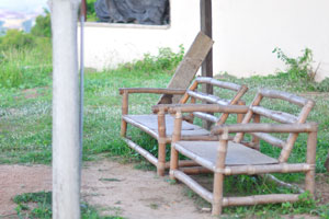 A garden bench is on the territory of Nana Bema hotel