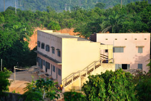 Two-story building as seen from the viewing platform of Nana Bema hotel