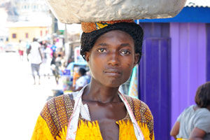 A charming Ghanaian young woman is on the Mpoben Fishing road