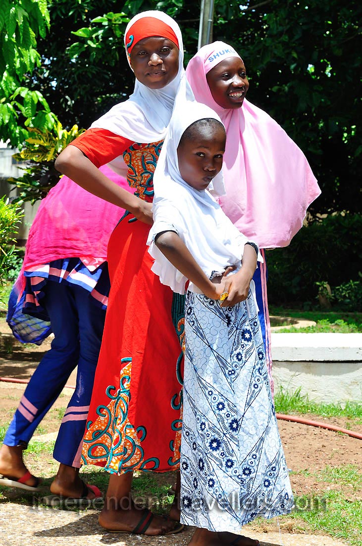 Young African fair maidens are striking lovely poses
