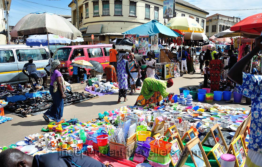 Colorful cups and other utensils are on the central market
