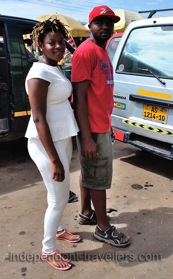 A pair of young African people are on the central market