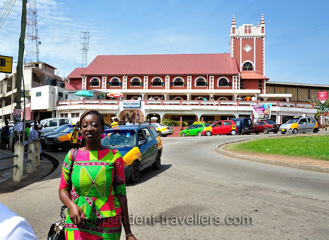 A beautiful Ghanaian woman is on the background of Wesley Methodist Cathedral