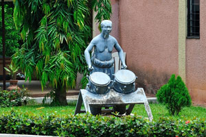 A statue of a drummer is in the Centre for National Culture