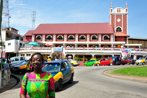 A beautiful Ghanaian woman is on the background of Wesley Methodist Cathedral
