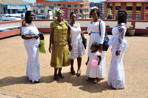 Female parishioners of Wesley Methodist Cathedral are dressed mostly in white