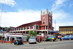 Wesley Methodist Cathedral as seen from the roundabout with a lion statue