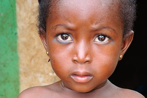 Adorable little Ghanaian girl wearing a necklace around her waist
