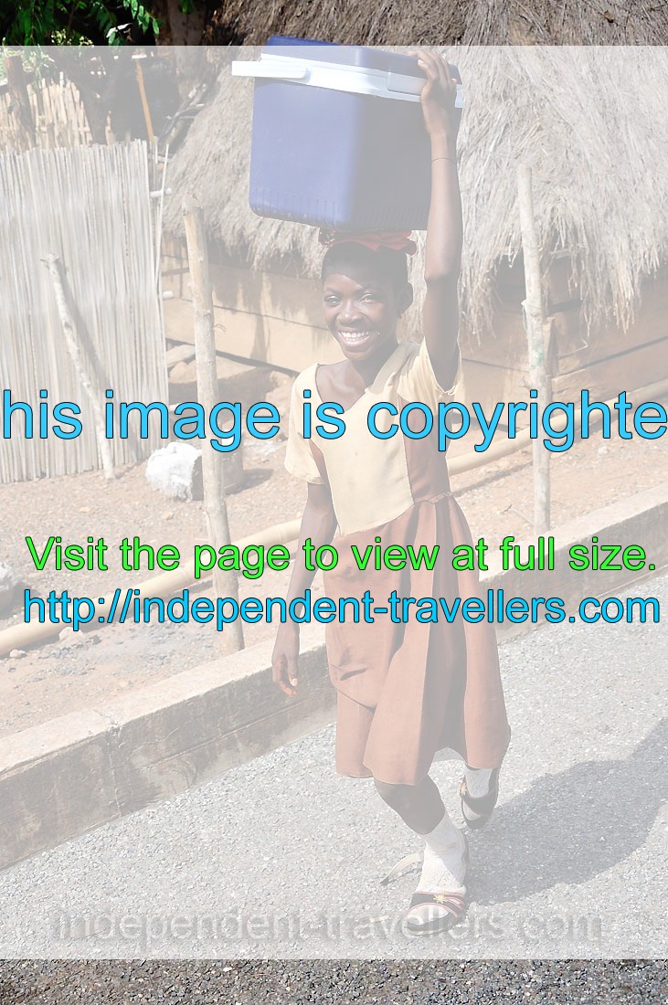 A smiling Ghanaian school girl