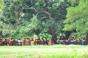 The school lesson takes place in an open air