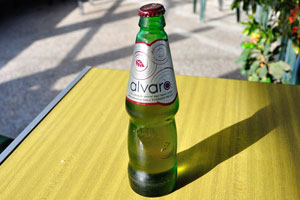 The bottle with drink of Alvaro is in the Crest restaurant