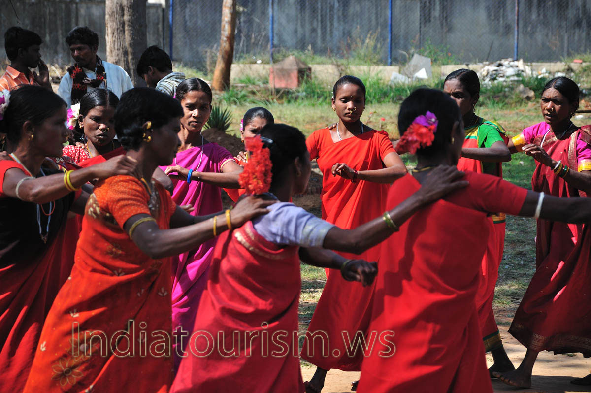 each woman put her hand on the shoulder of the next dancer