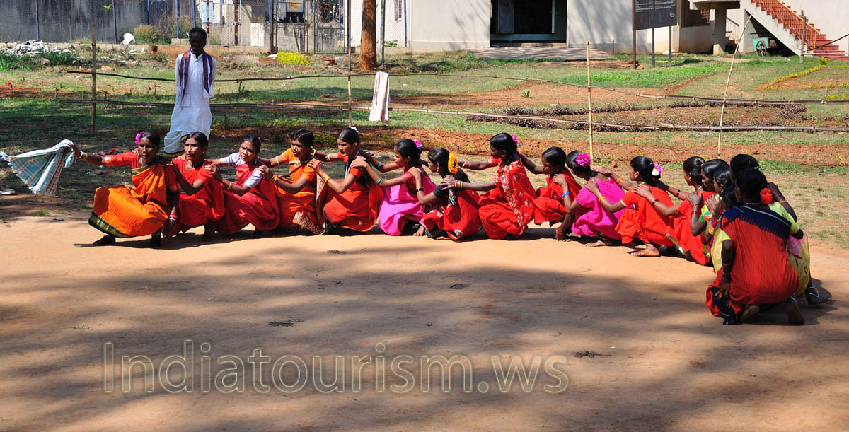 group of dancers moves in single file