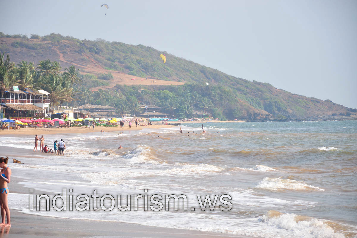 Paragliders in the air are over the sea