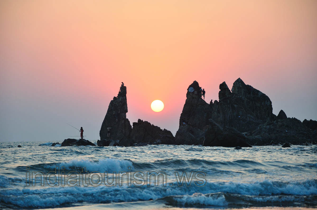 people meet sunset on the rocks