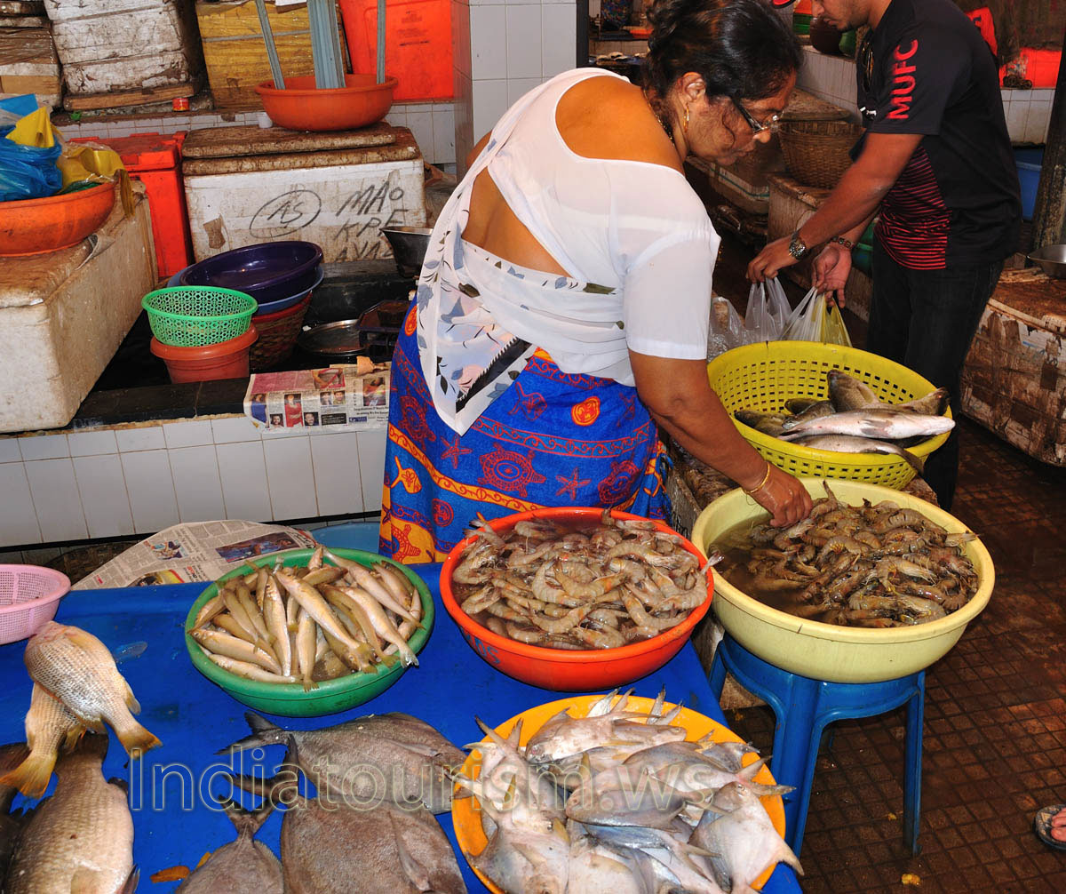 Fish Market: woman sells the prawns