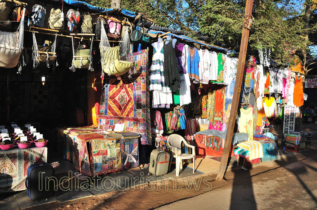 different clothes, bags and tiny hammocks on sale