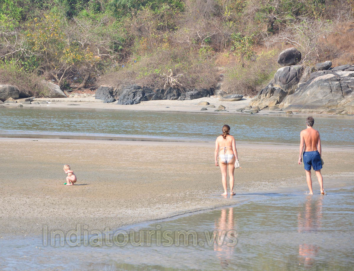 family relax on the northern side of the beach