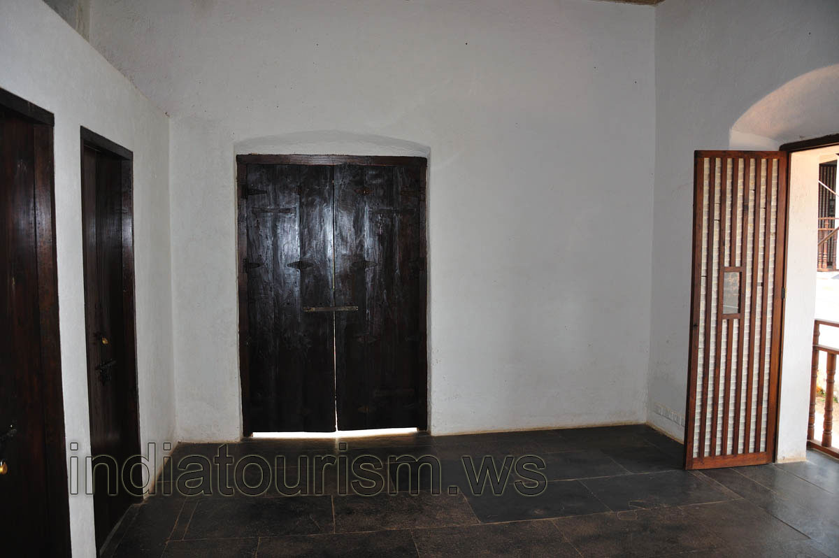 Three black doors are closed