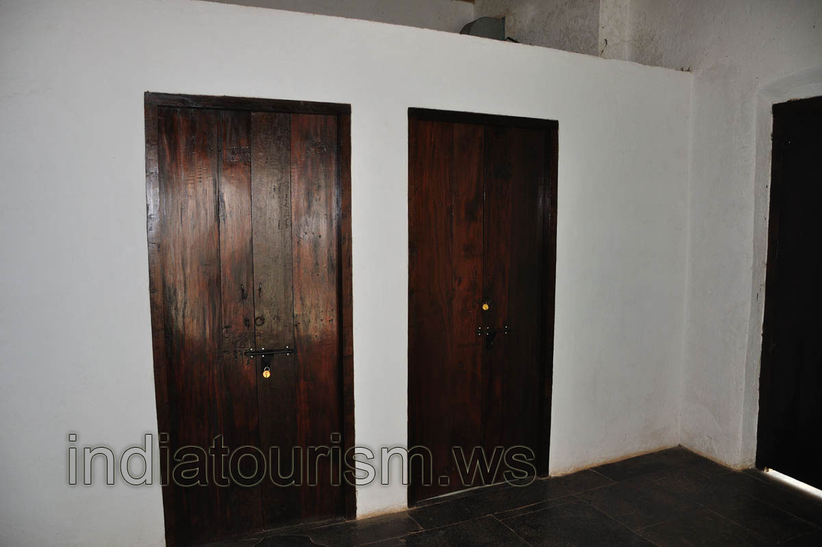 White wall with the black doors