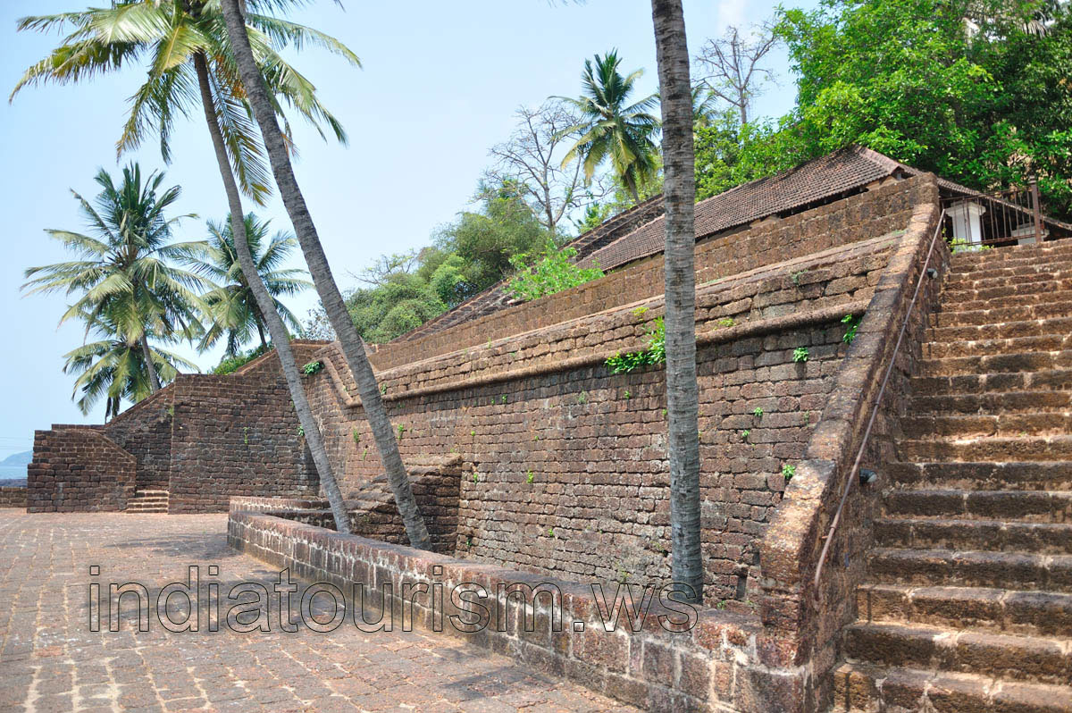 Coconut palms grow from the midst of the fort