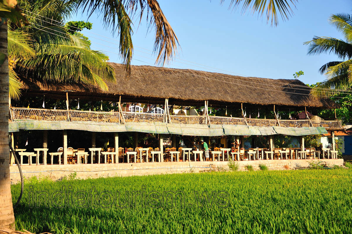 two-storey restaurant with rice field view