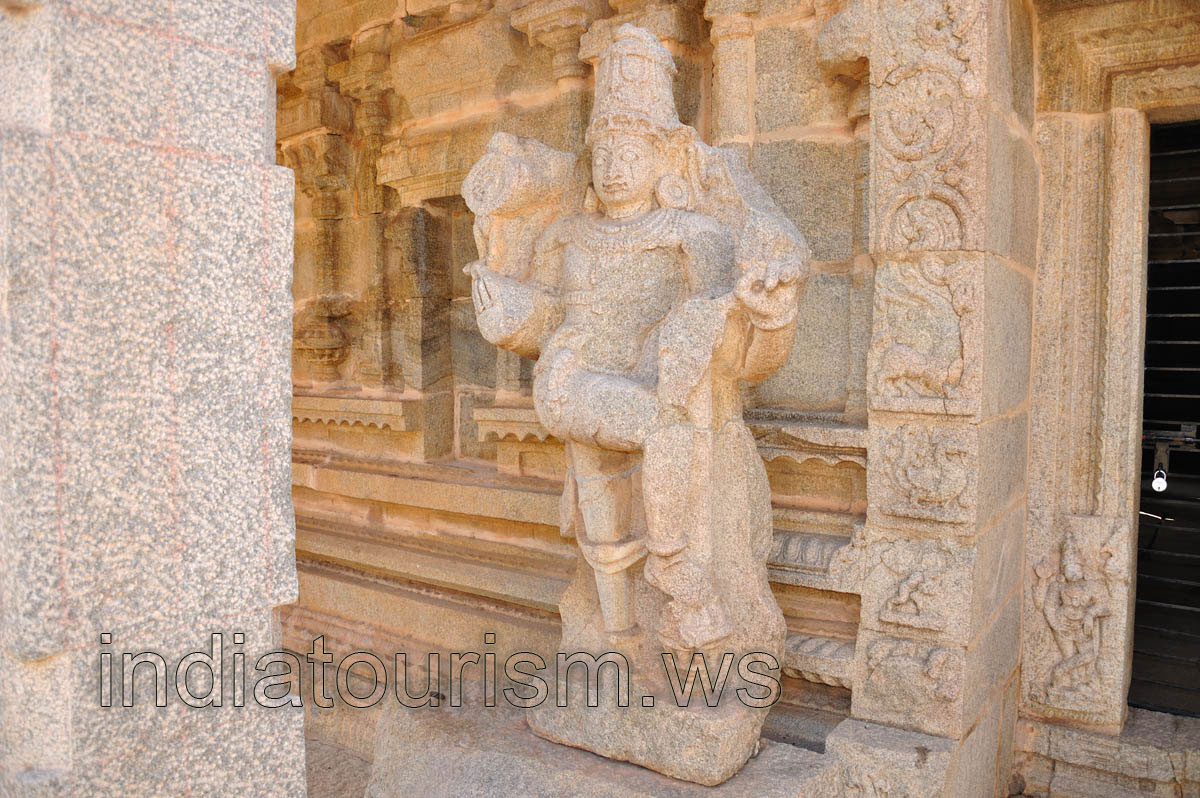 second guard deity stands near the door to the inner sanctorum
