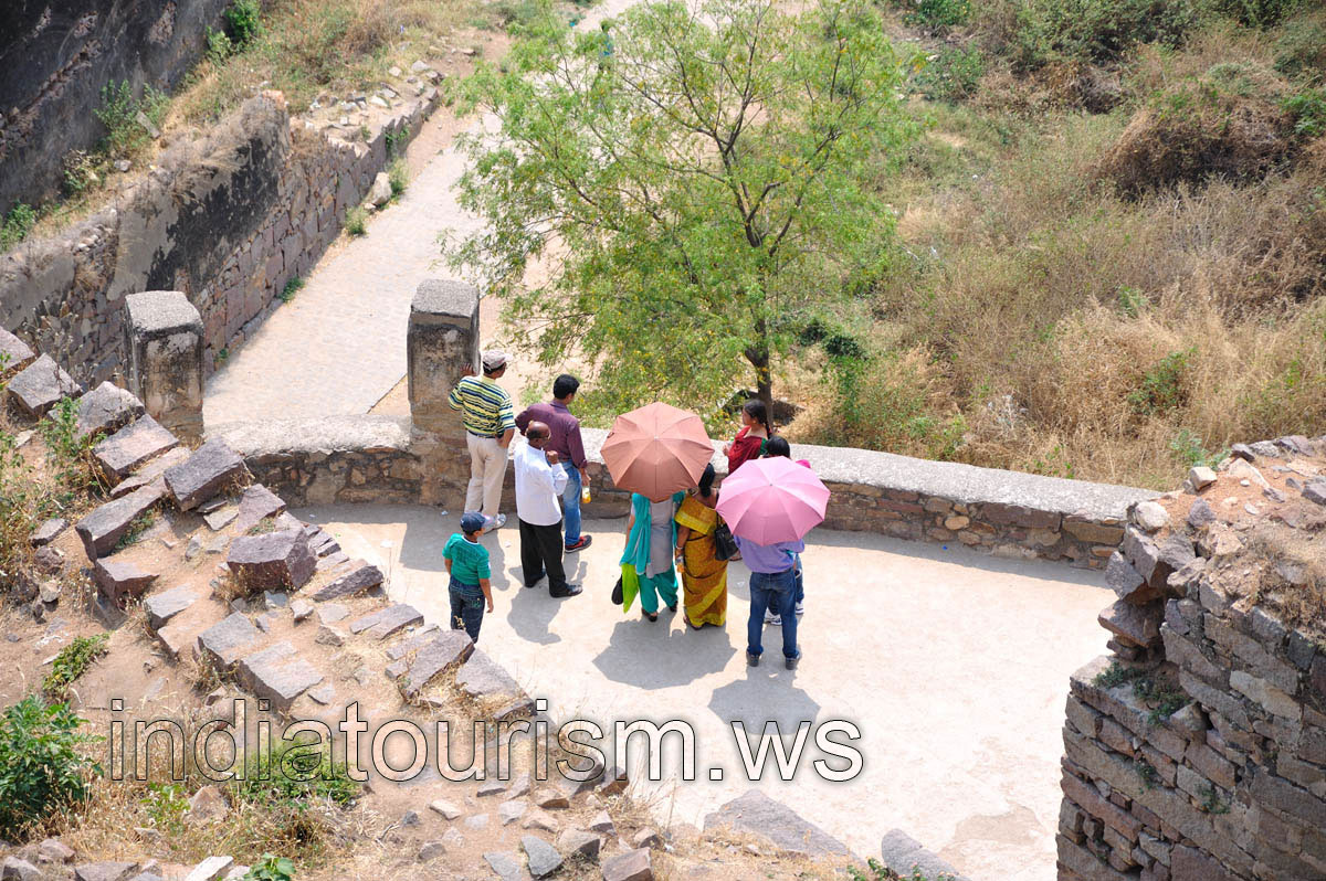 Indian travellers with the open umbrellas