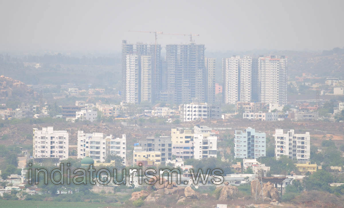 Building cranes have risen above the city