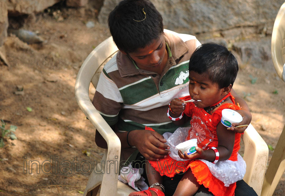 Small girl eats an ice-cream