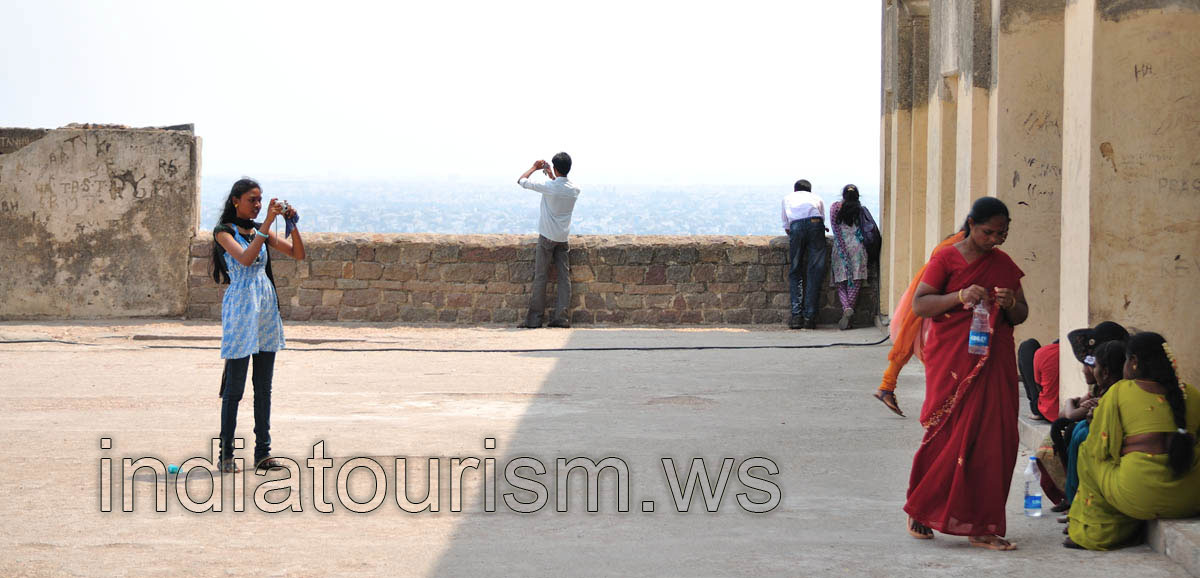 Tourists are photographing at the highest point of the fort