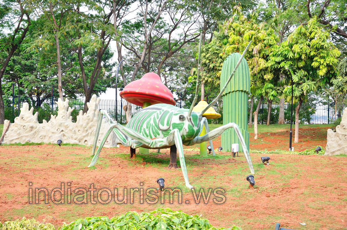 Huge artificial white-green grasshopper