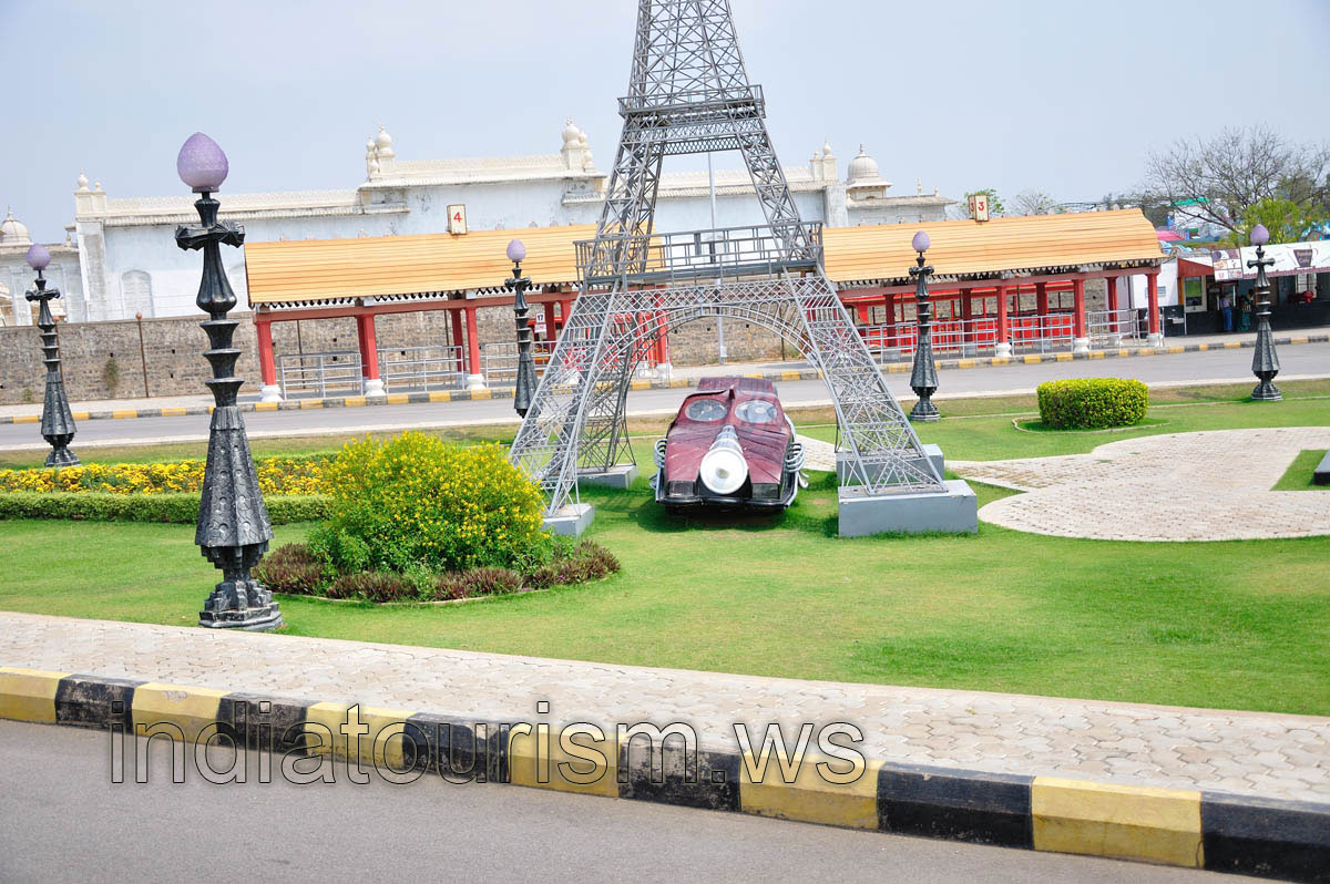 Toy automobile under the Eiffel tower statue