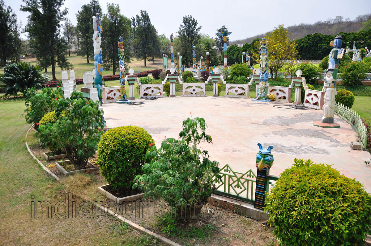 Tall statues and a tiny fenced area