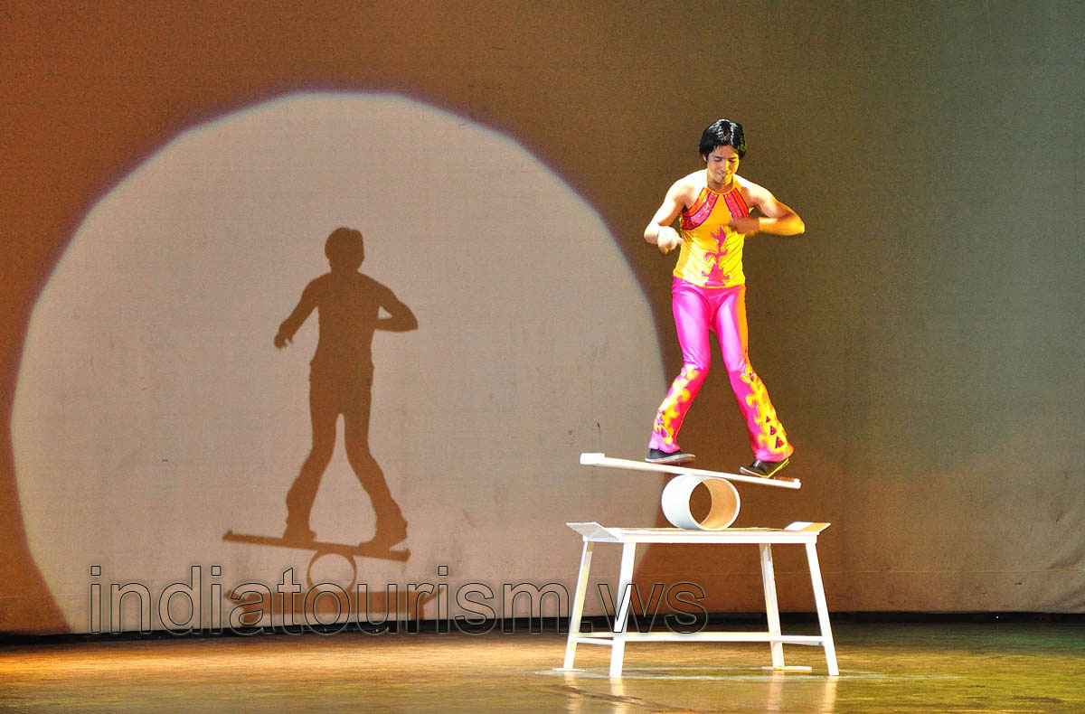 Spirit of Ramoji - acrobat is balancing over the cylinder