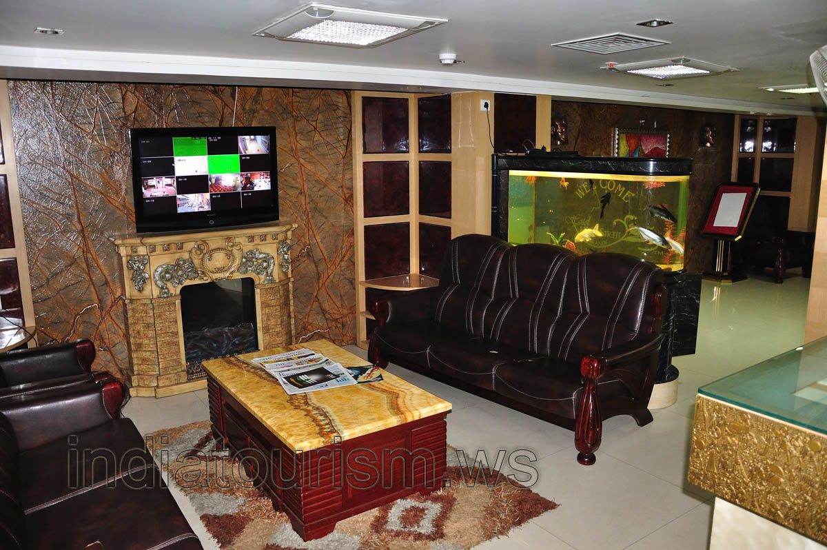 High Street Grande Hotel, armchair and aquarium at the reception