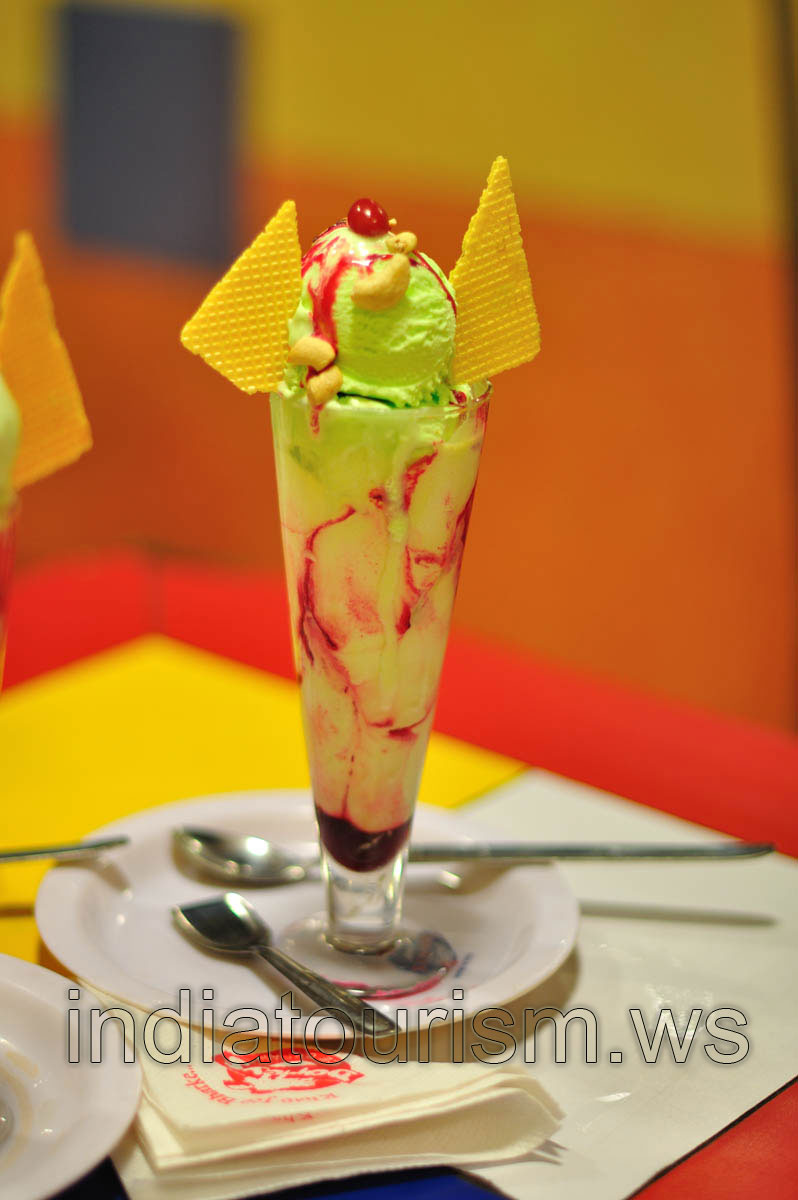 Pista ice cream has been served in a tall glass