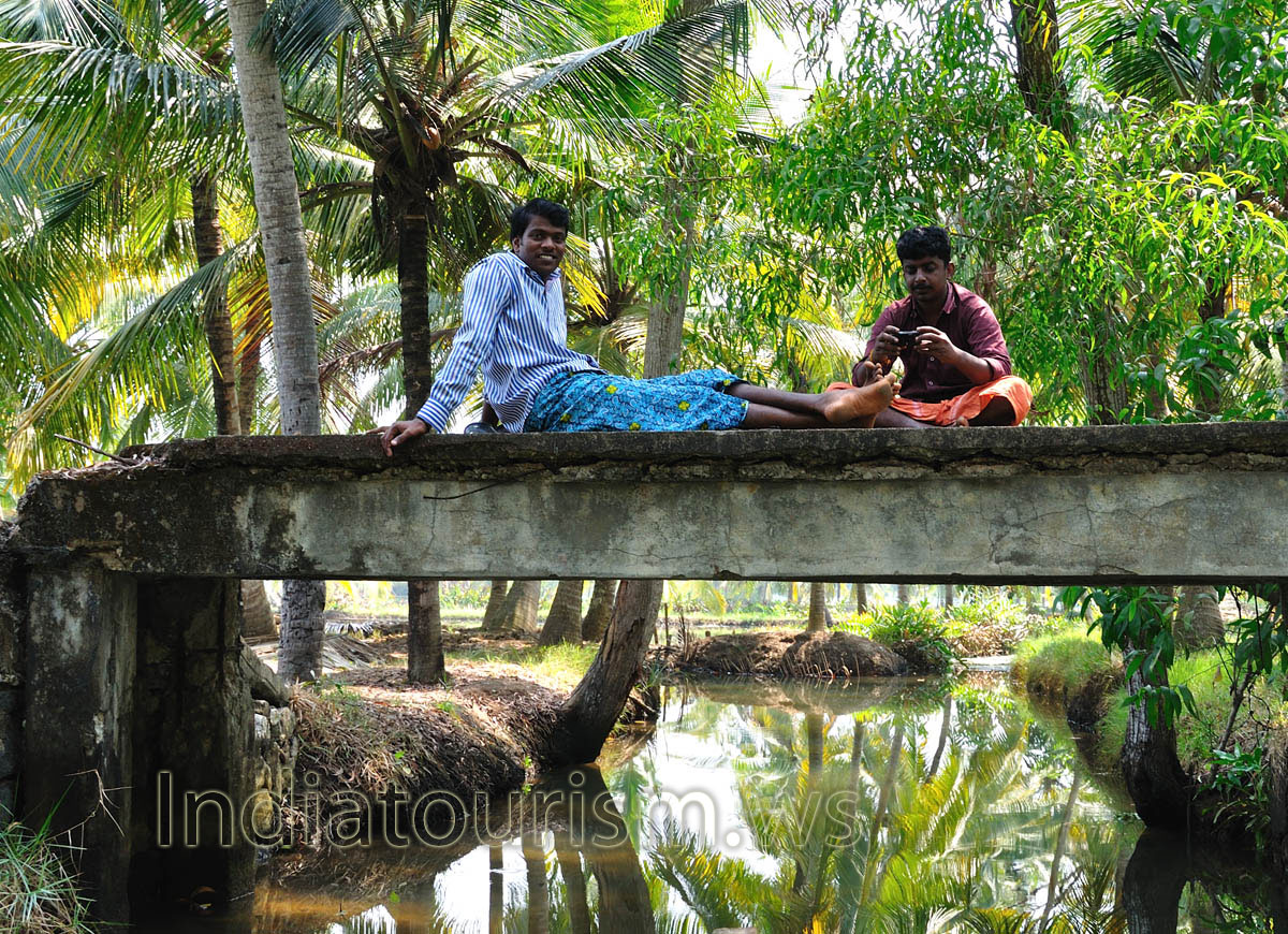 indians sit on the small bridge and try to photograph us