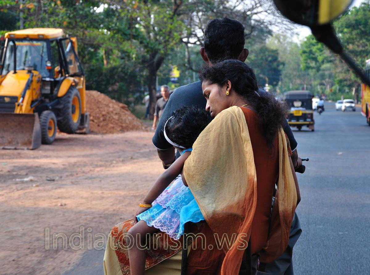 on the road from Varkala to Parippally - the girl fell asleep on a motorcycle