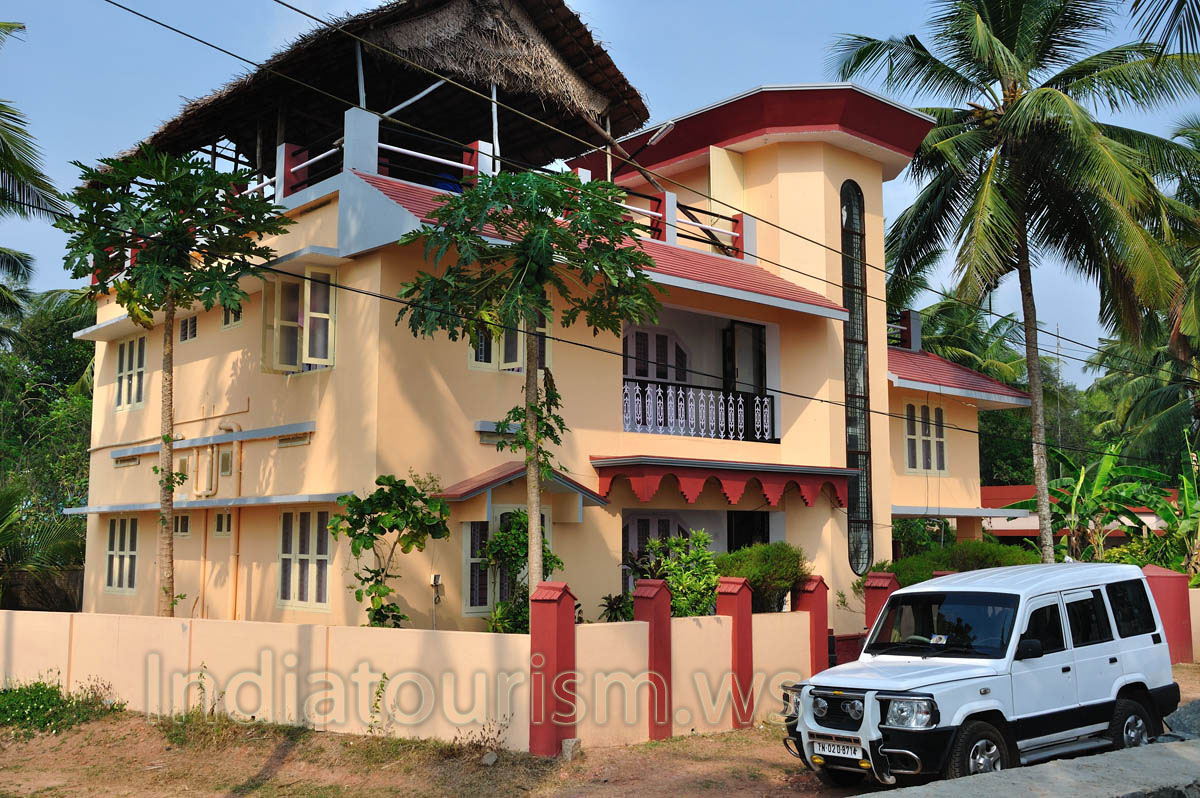 expensive two-storey hotel with papaya trees in the garden
