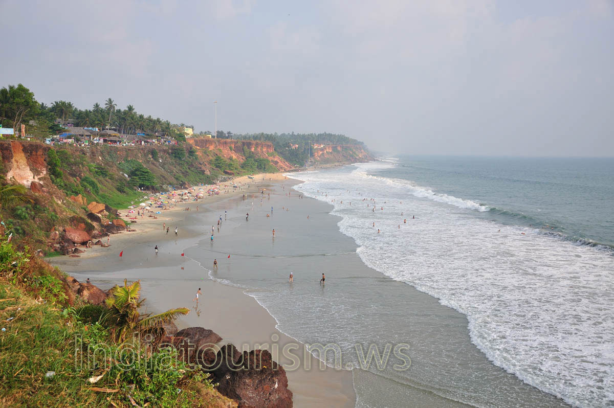 There are many people on the beach in the evening time