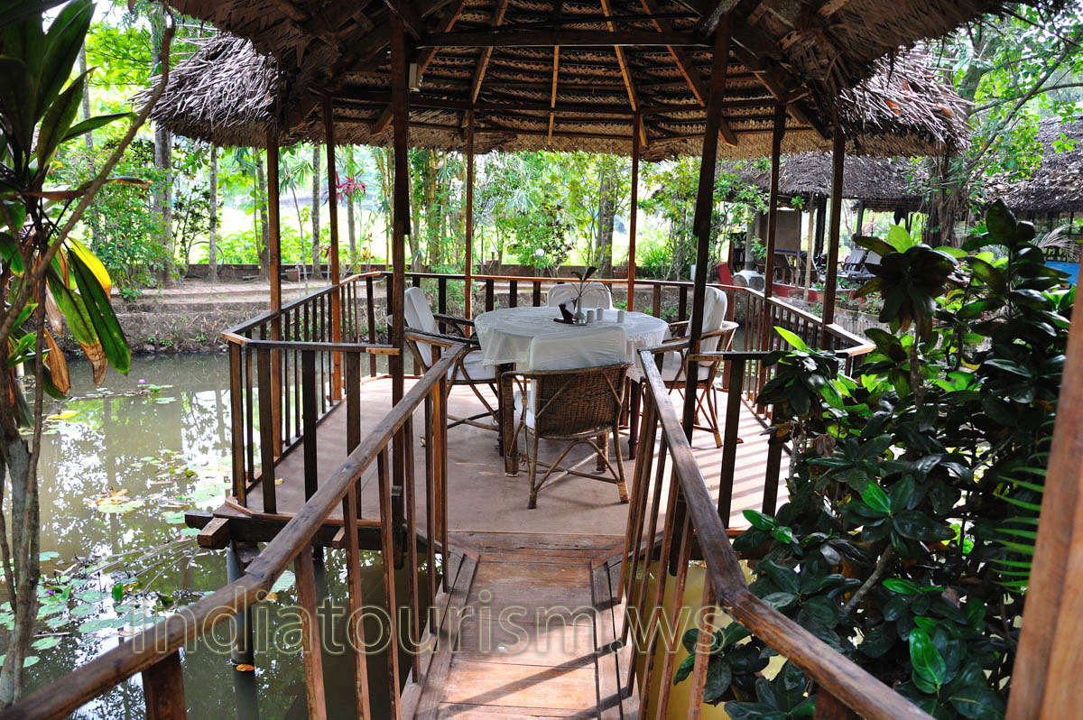 gazebo is located in the middle of artificial pond