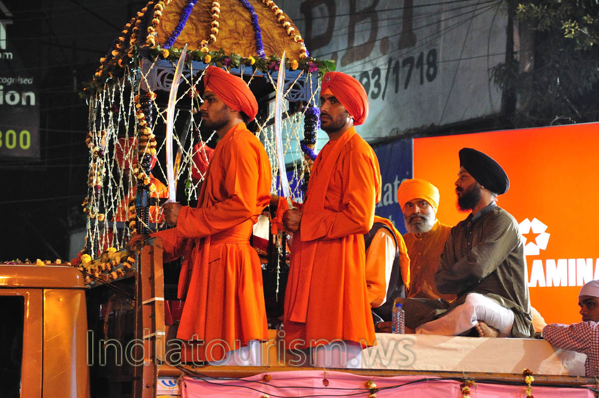 Men in smart suits with the swords in their hands