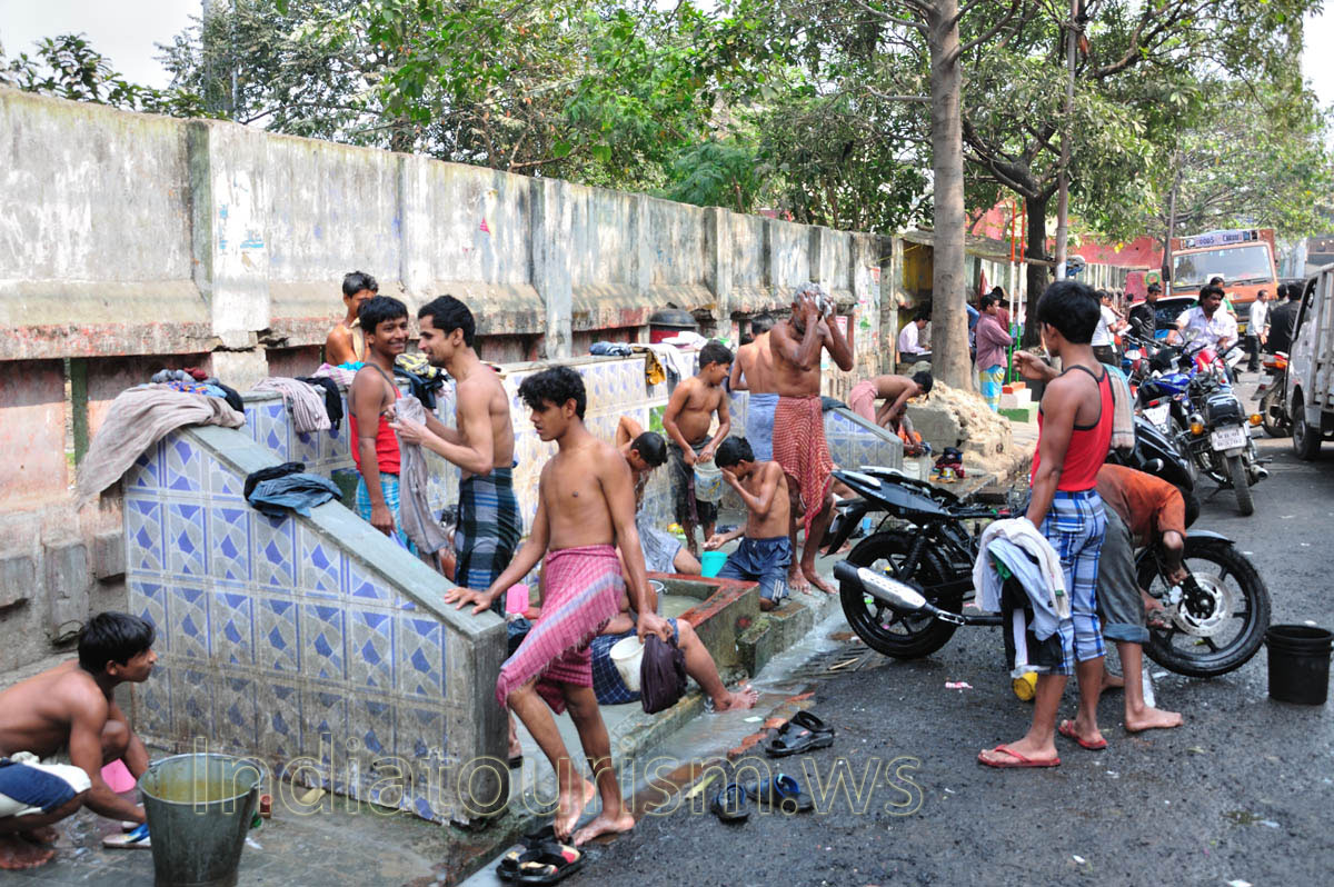 on the streets of Kolkata people take water treatments with great pleasure