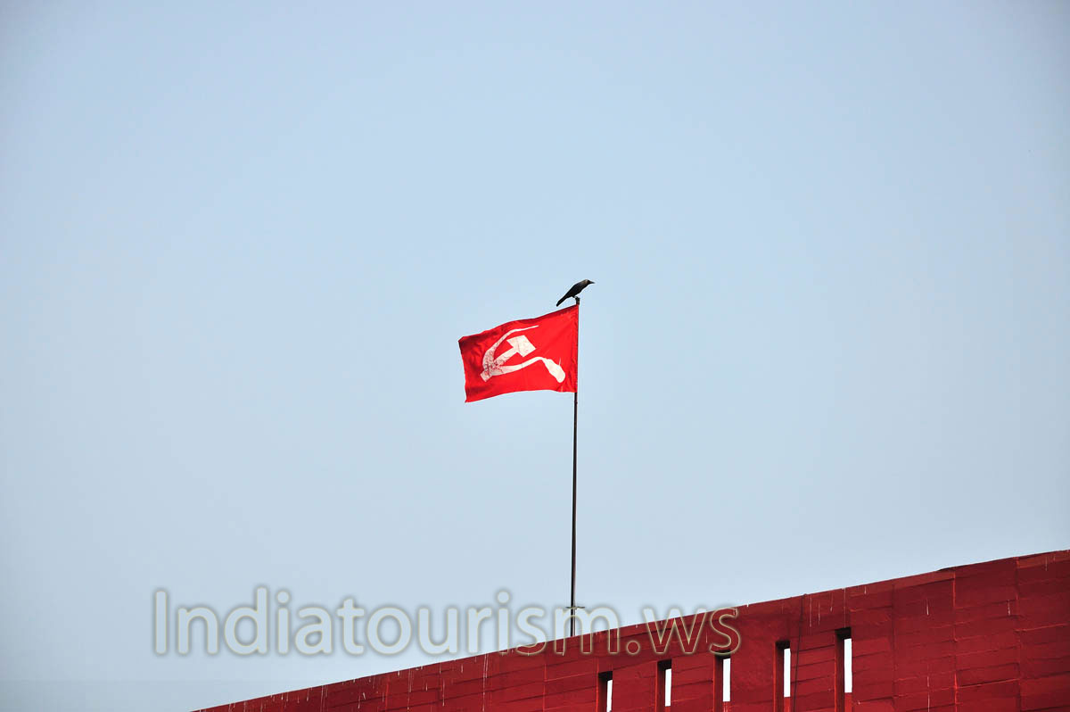 The are communist symbols: the hammer and sickle on the red flag